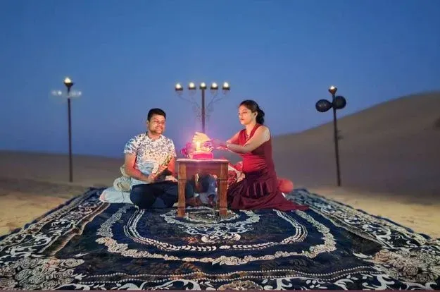 private candle-light dinner setup At Thar Desert Sam Sand Duens, Jaisalmer